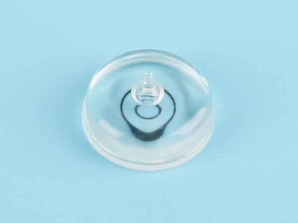 Glass circular bubble level vial has a black sight line and a tip.