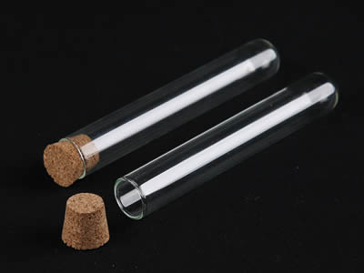 A closed and an opened glass test tube with cone shape cork stopper on the black background.