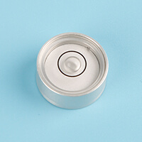 A metal bullseye level vial