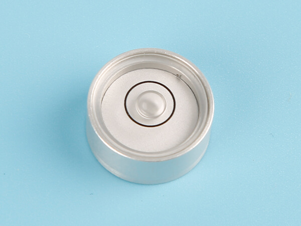 A metal bullseye level vial