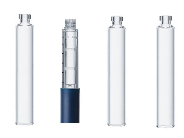 Several pharmaceutical glass cartridges are displayed.