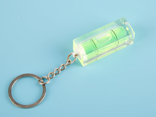 A plastic key chain bubble level vial