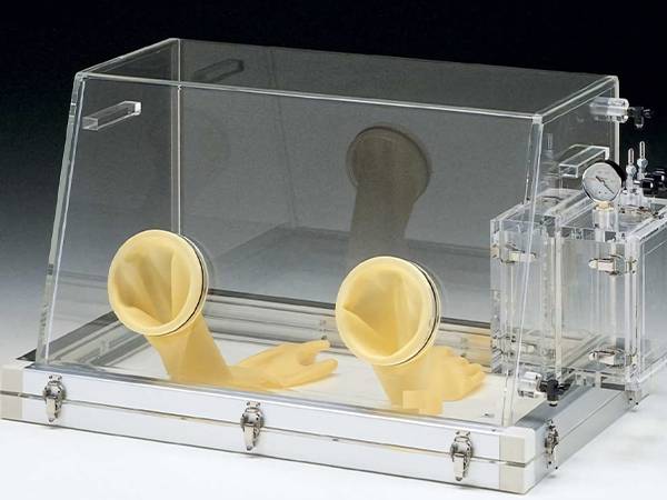 Radiation resistant glass glove box with rubber gloves