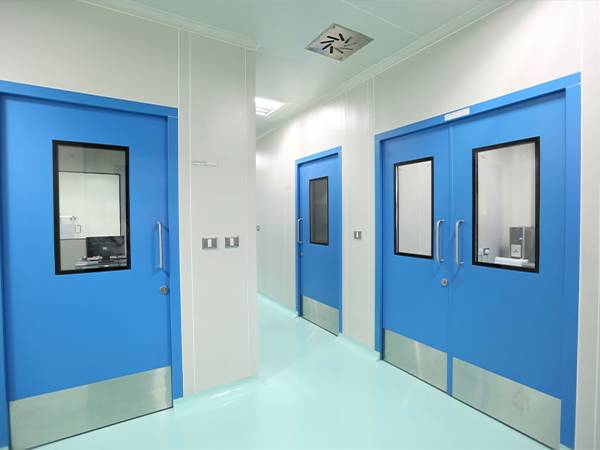 Blue door of the laboratory fitted with radiation shielding glasses
