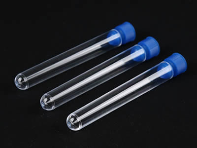 Three plastic test tubes with blue color plastic stoppers on the black background.